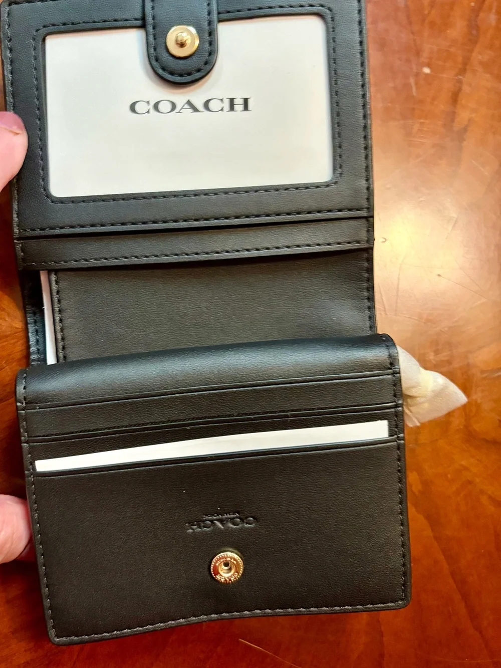 COACH Black Pebbled Leather Compact Bifold Wallet with Gold Logo